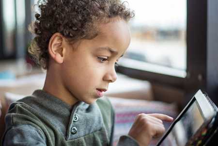 Child reading tablet